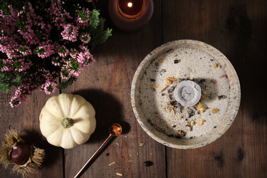 Preparation for a Samhain incense ritual - incense burner with glowing charcoal