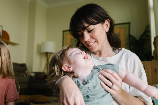 Mother with a baby who needs food through the tube at home