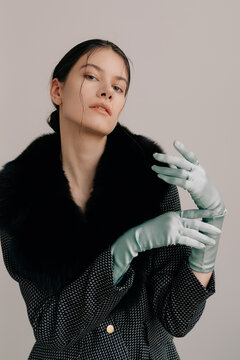 Cinematic fashion portrait with satin gloves and fur collar