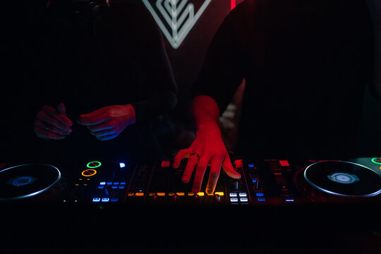 DJ Plays Music at Night Club During a Vibrant Event in the City