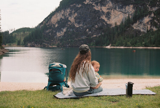 Anonymous mother with daughter on the lake shore