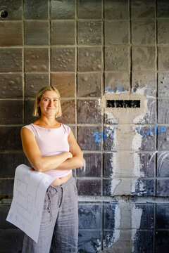 Portrait of architect at unfinished renovation site