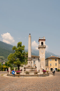 Historic village square with fountain in Trentino, Italy