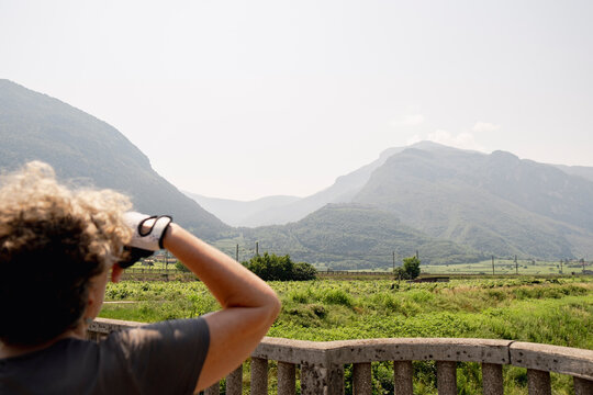 Senior woman looking at mountains during bikepacking trip