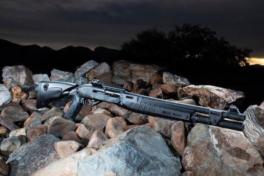 Semi-auto tactical shotgun ready for work as the sun sets behind
