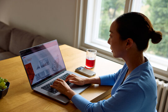 Woman uses a laptop for her project