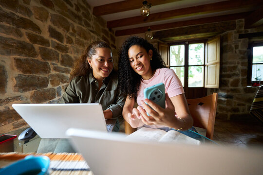 Women cooperating remote working at home
