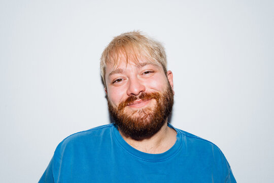 Smiling Young Man with Freshly Styled Blond Hair