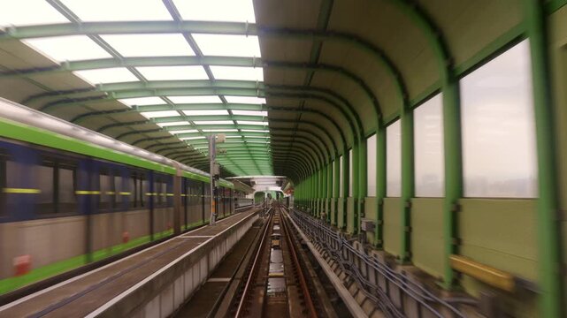 Taichung, Taiwan-6.20.2026: The Taichung MRT train climbs the ramp and enters the station