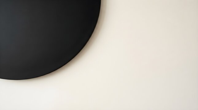 Minimalist black quarter circle shape on a solid cream background featuring clean lines and modern abstract geometric composition