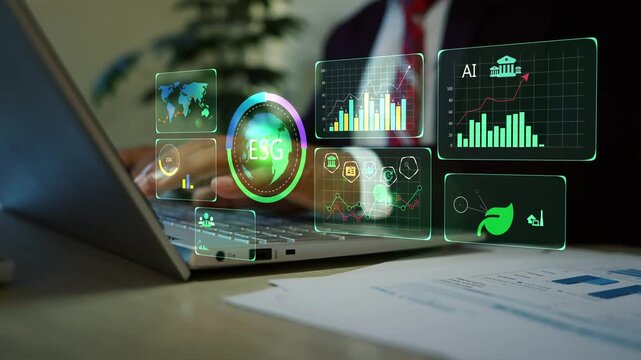 Business professional using laptop with glowing hologram business data graph charts dashboard, Holographic world map and charts above financial documents on desk.
