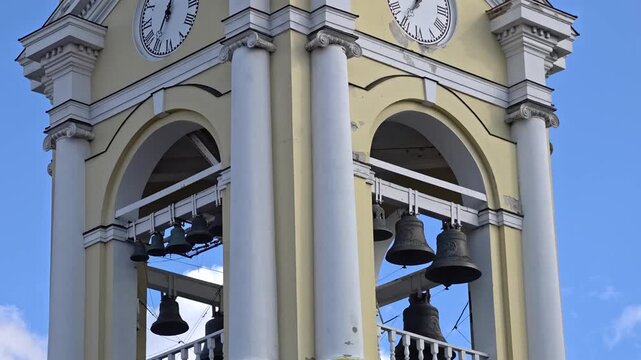 Russia, St. Petersburg, August 8, 2020 A clock tower with bells and a sky background, great for use in travel or architecture photos