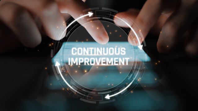 Close-up of Hands Typing on a Keyboard with a Digital Overlay Symbolizing Continuous Improvement and Innovation in Technology and Business Processes Sigmoid