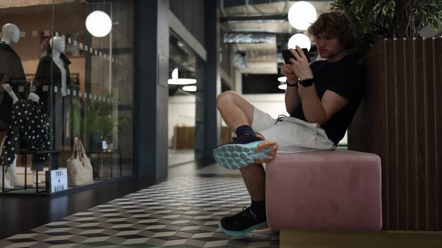 Student wastes time scrolling on his phone instead of learning and self development showing digital distraction procrastination and lack of personal growth in modern life