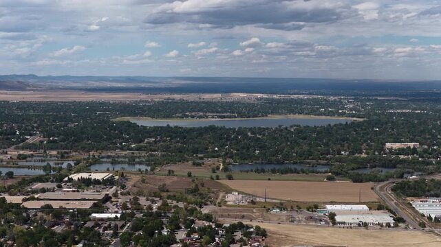 Aerial of lake and suburban landscape in Larimer County Colorado near Loveland with surrounding residential areas