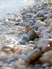 close up of some colorfoul pebbles being hit by the waves at a beach in Baska, Croatia © Isabella