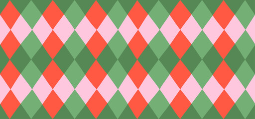 Obraz premium Seamless argyle pattern with imperfect hand-drawn rhombus shapes in green, red and pink colors. Classic textile design for Christmas wrapping paper and holiday backdrop, vector illustration.