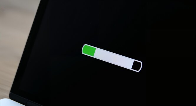 A close-up of a loading progress bar displayed on a laptop's screen � Professional Stock Photography Concept for Commercial and Marketing Use
