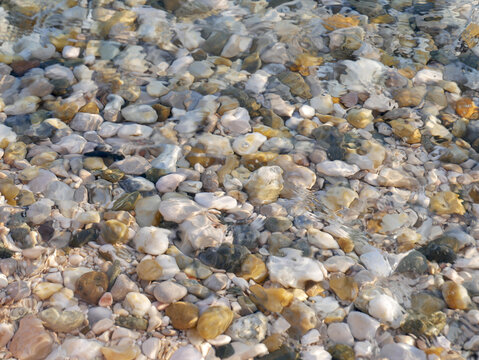 close up of some colorfoul pebbles underwater at a beach in Baska, Croatia