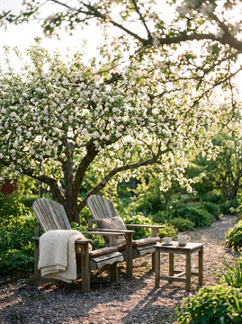 Copertina libro amore with cozy wooden chairs under blooming apple tree in spring garden for romantic novel