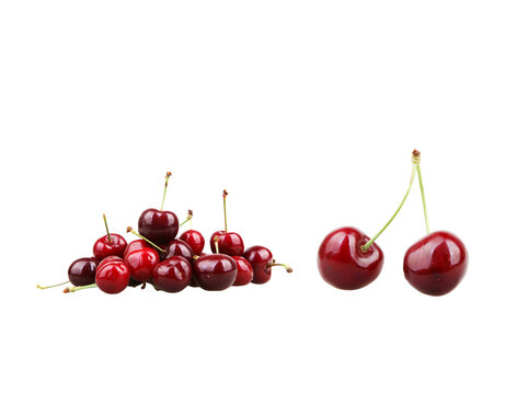 Fresh red cherries on white background, ripe sweet cherry fruit pile, organic summer berries for food packaging and healthy recipes
