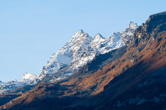 View of rocky mountain peaks and wild nature landscape. High altitude mountain ridge under open sky.