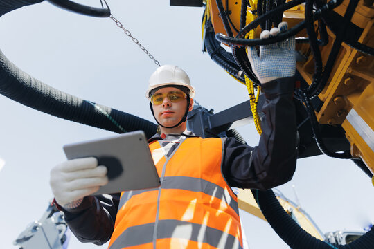 Industry operator use mobile tablet computer for control drilling rig, industrial technologies