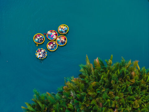 Aerial view of tourists in round boats on thu bon river, hoi an, vietnam