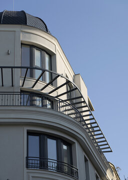 Modern corner building facade with dome roof