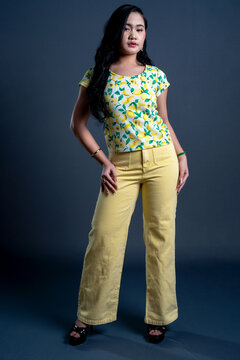 Portrait of young woman in yellow theme cloth