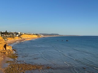 view along the cliffs to the Cala del Puntalejo and the Búnker de Fuente del Gallo at the Atlantic Ocean near Conil de la Frontera during sunset, Cadiz, Costa de la Luz, Andalusia, Spain © keBu.Medien