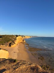 view from the cliffs to the Cala del Puntalejo and the Búnker de Fuente del Gallo at the Atlantic Ocean near Conil de la Frontera during sunset, Cadiz, Costa de la Luz, Andalusia, Spain © keBu.Medien