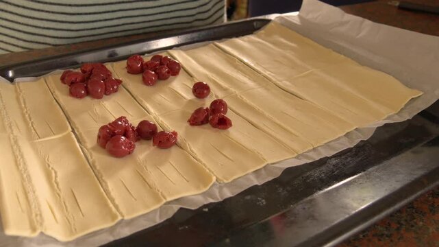 Preparing Homemade Cherry Puff Pastry in Kitchen
