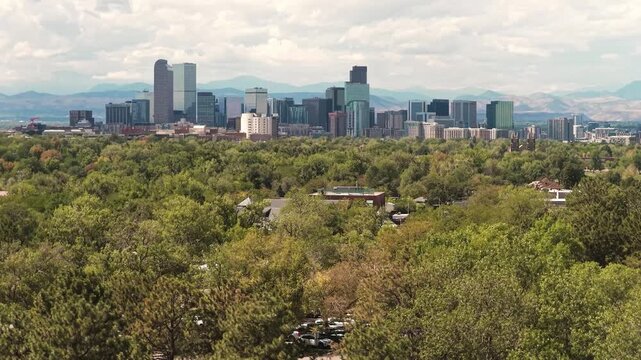 City skyline sunny day with clouds reveal drone video Denver 4K