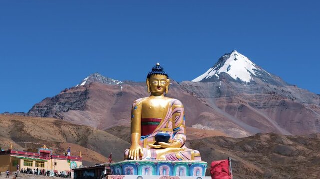 Beautiful Wide Aerial View of Langza High Altitude Village in Spiti Valley, Himachal Pradesh with the Maitreya Buddha Statue, Tourists and Vast Rocky Himalayan Landscapes