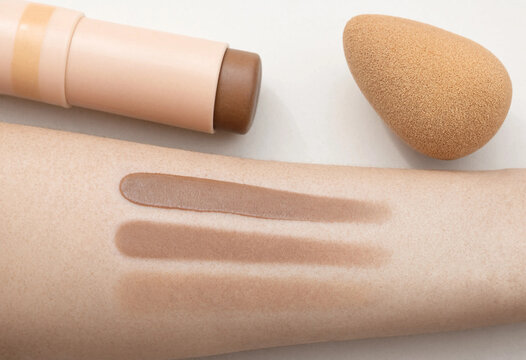 Contour stick application and blending stages on skin