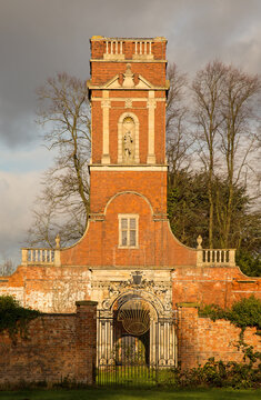 A 17C tower above a cast iron gate