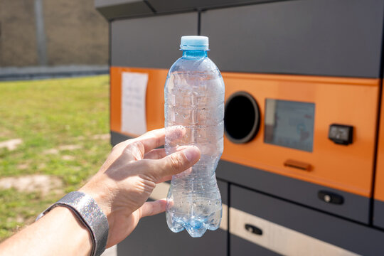 Beverage bottles in front of a packaging return station.