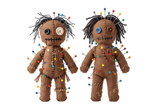 Two handmade burlap voodoo dolls with button eyes and colorful pins stuck in them isolated on transparent background