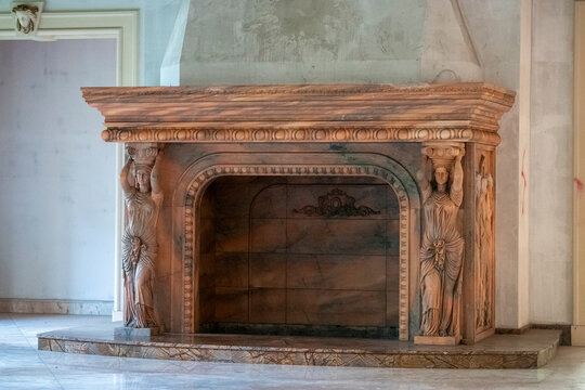 Abandoned luxury mansion interior with marble hall, ornate fireplace, swimming pool and glass facade