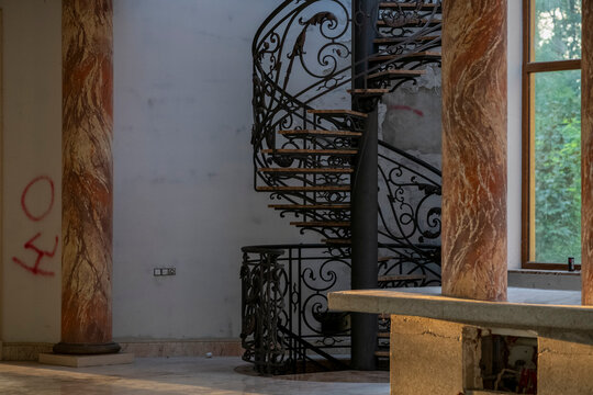 Abandoned luxury mansion interior with marble hall, ornate fireplace, swimming pool and glass facade
