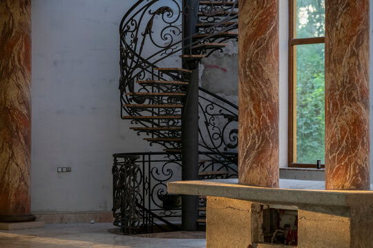 Abandoned luxury mansion interior with marble hall, ornate fireplace, swimming pool and glass facade