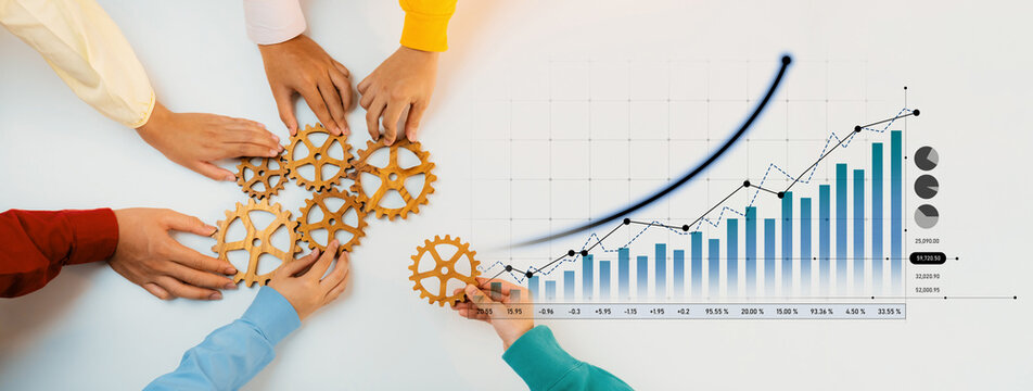 Close-up of hands working together on wooden gears with a financial growth graph in the background, illustrating collaboration, planning, and business success. Scalp