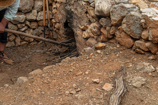 Traditional stone furnace oven for heating water in rural Spain during raisin drying