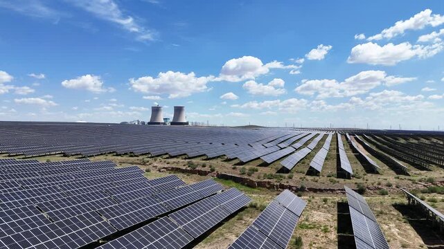 photovoltaic solar panel array under blue sky and white clouds
