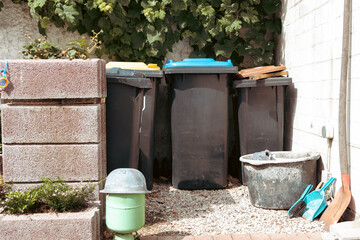 Obraz premium A view of part of the service yard, featuring waste sorting bins.