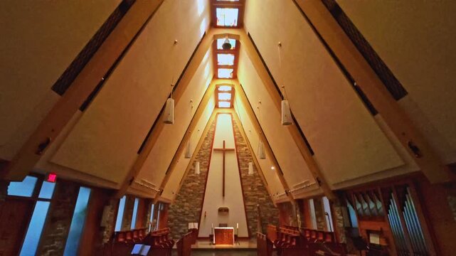 Quebec, Canada - Septembre 12 2026: A serene 4K video showing the modern interior architecture, wooden vaulted ceiling, and warm natural lighting of the Abbaye Cistercienne Notre-Dame de Nazareth chap