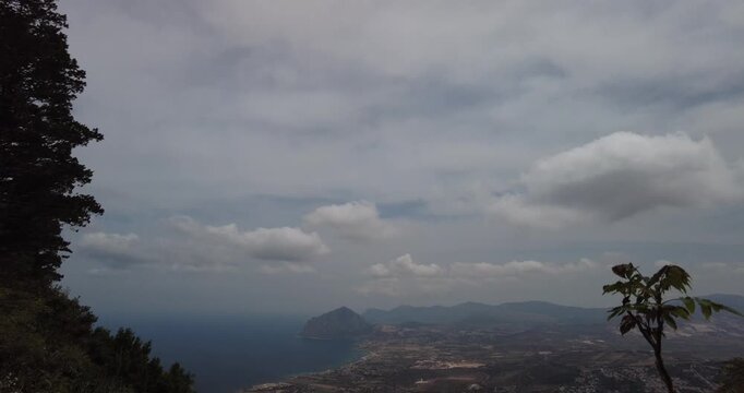 Tilt Down Shot Revealing Panoramic View of Sicilian Coastline and Monte Cofano from Erice, Italy