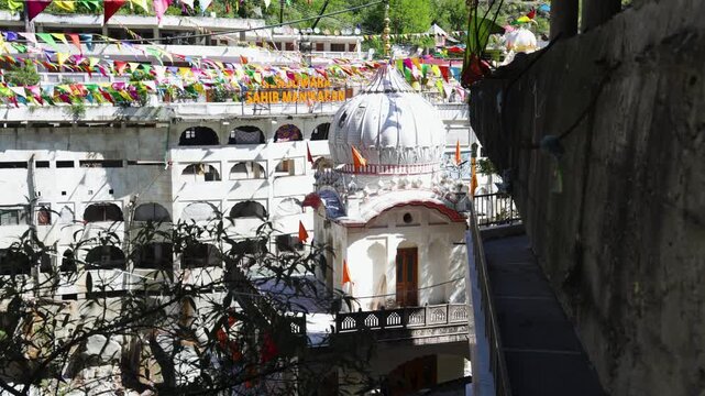 White Domed Manikaran Sahib Gurudwara With Vibrant Festive Decorations