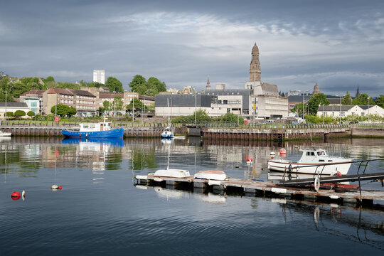 Boat moored in marina at Greenock with Town Hall tower in background